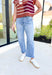 Ava Super High Rise Barrel Denim by Flying Monkey, light wash barrel jeans with light distressing under the right pocket and frayed hems on the ankles 