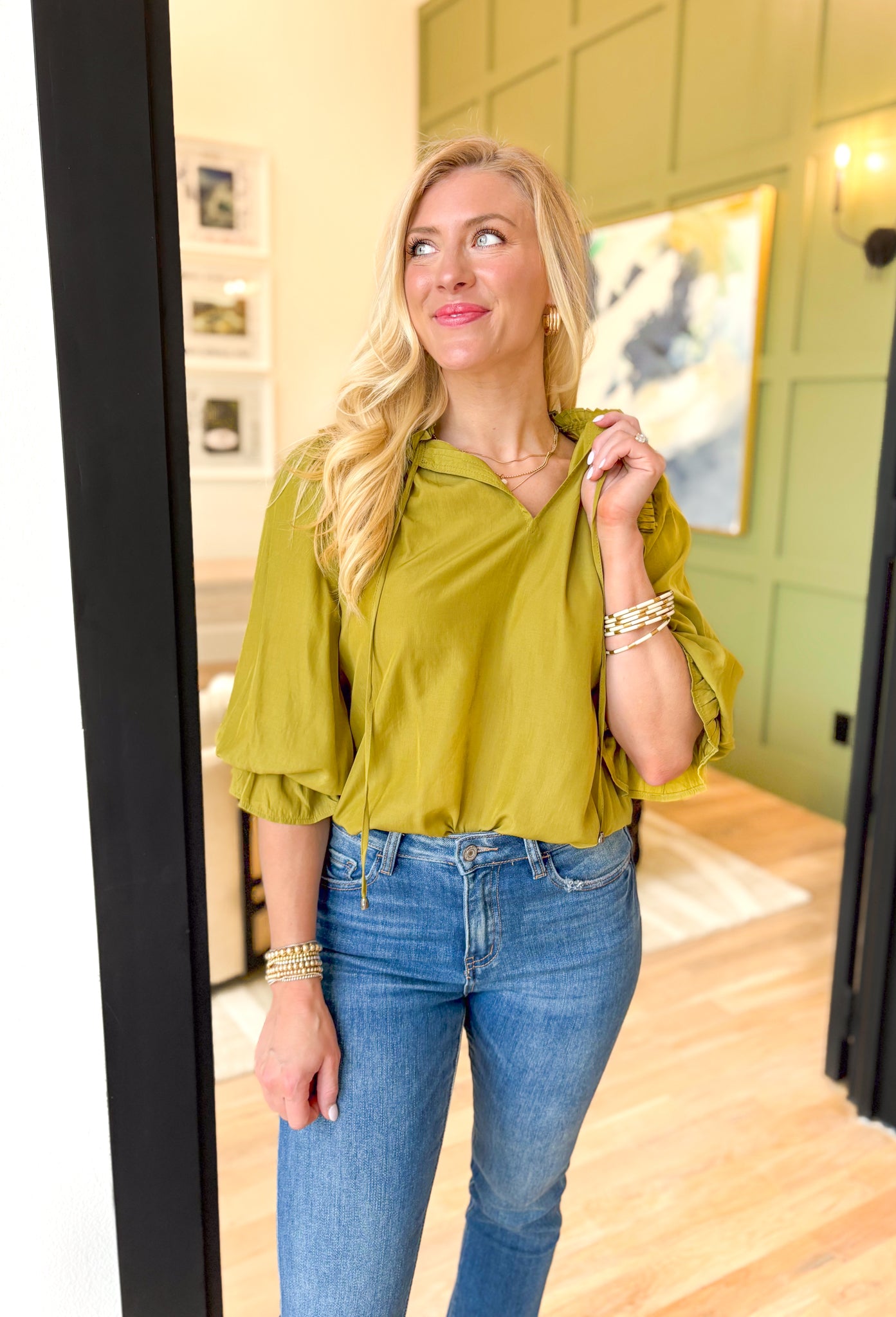 Best Effort Blouse in Olive, quarter sleeve blouse with ruffle detail around the neck and on the shoulders, v-neck line, ruffling on the bottom of the sleeves 