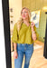 Best Effort Blouse in Olive, quarter sleeve blouse with ruffle detail around the neck and on the shoulders, v-neck line, ruffling on the bottom of the sleeves 