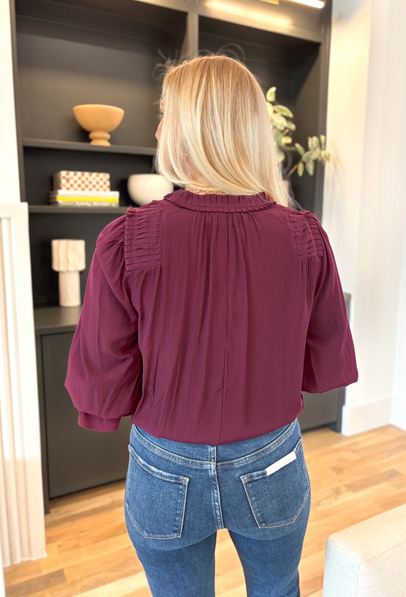 Best Effort Blouse in Merlot, quarter sleeve blouse with ruffle detail around the neck and on the shoulders, v-neck line, ruffling on the bottom of the sleeves 