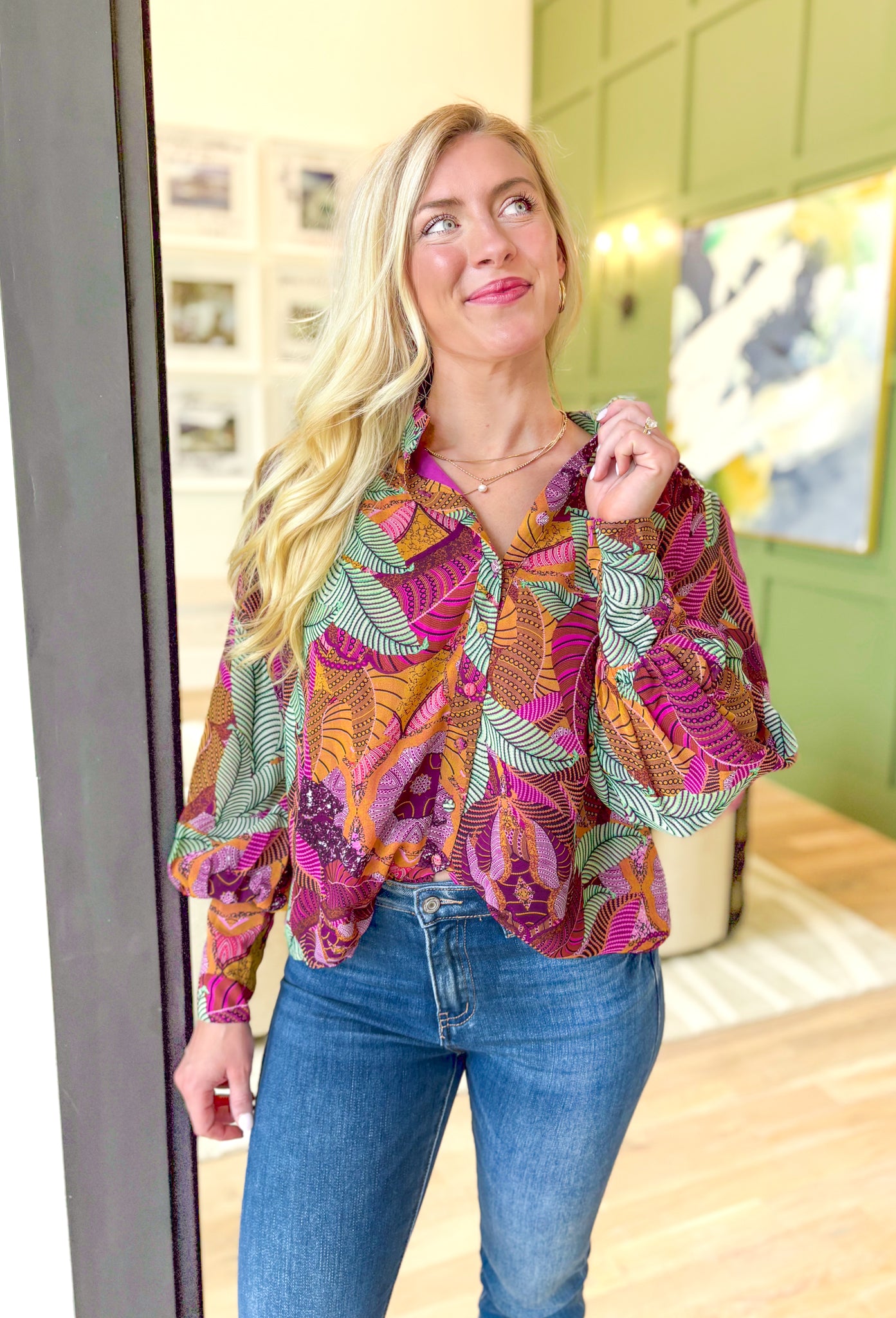 By Your Side Blouse, long sleeve button down blouse with abstract palm leaves in the colors burnt orange, sage green, magenta, deep plum, lilac, pink, cognac, and mustard, zipper detail on the wrists to make them fitted