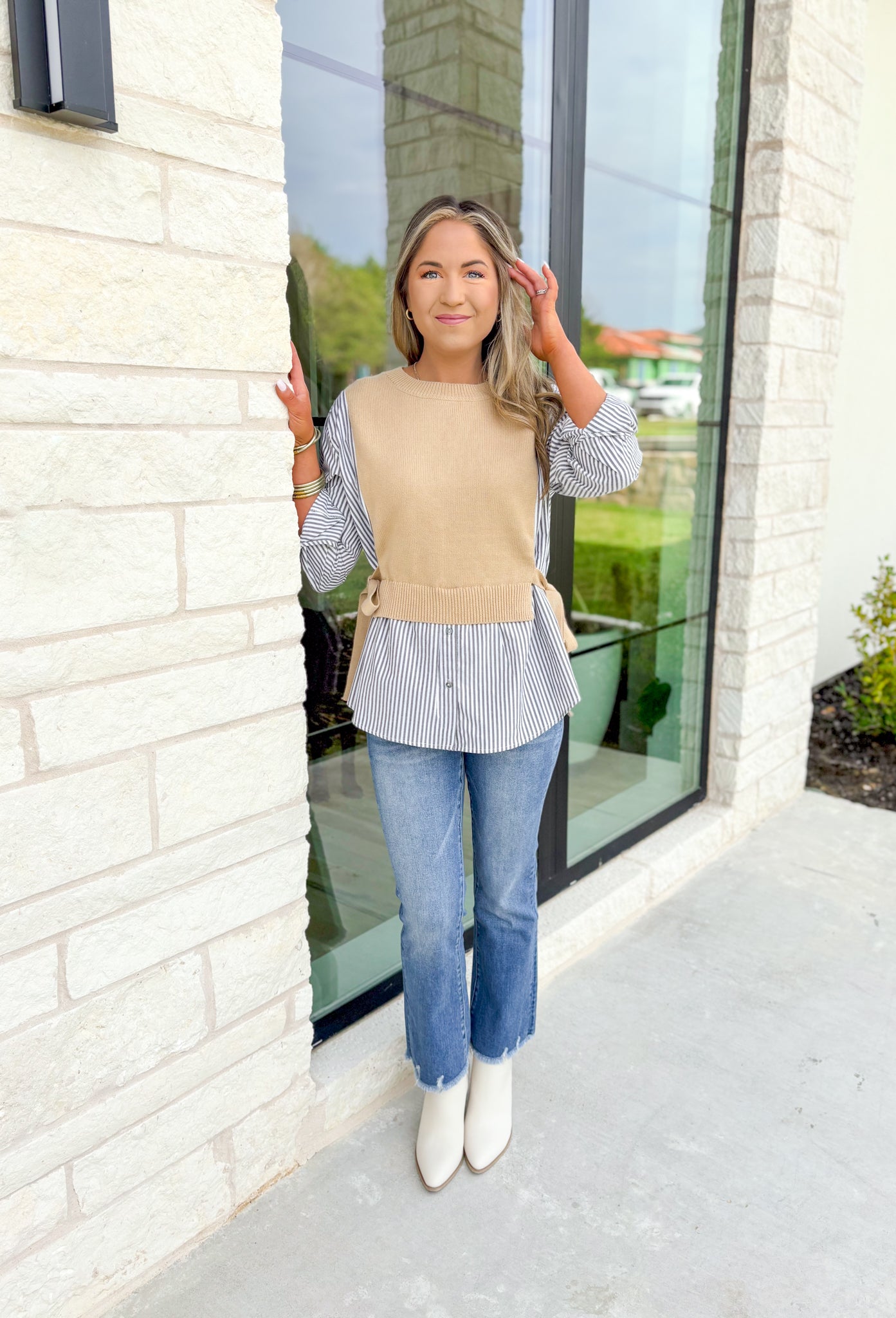 Care To Be Classic Top, grey and white pinstripe button down with camel sweater layered on top, tie details on the side 