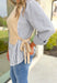 Care To Be Classic Top, grey and white pinstripe button down with camel sweater layered on top, tie details on the side 