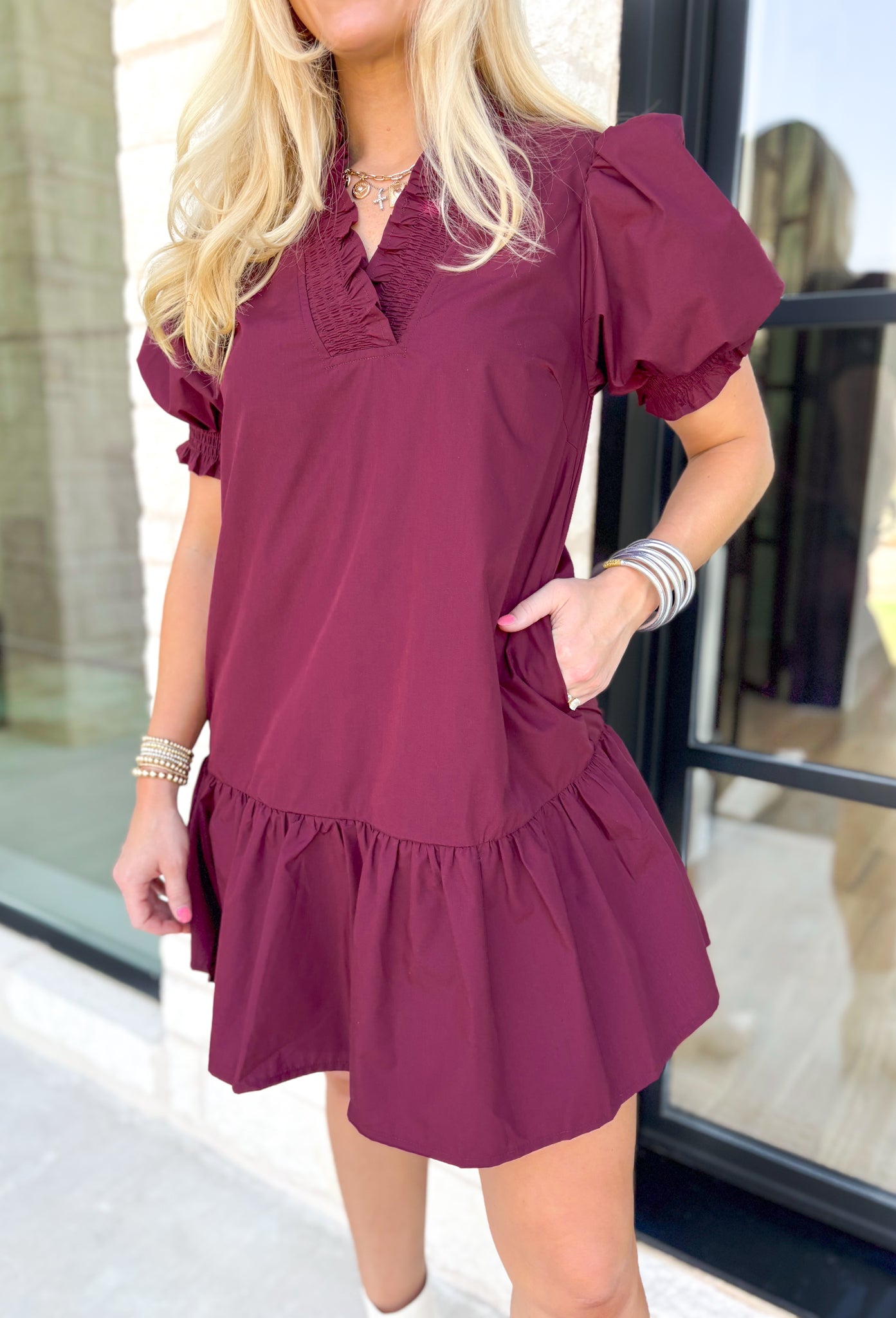 Caught Crushing Dress in Merlot, puff sleeve dress with smocked v-neck line and smocking on the hem of the sleeve, tier detail on the bottom hem of the dress 