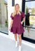 Caught Crushing Dress in Merlot, puff sleeve dress with smocked v-neck line and smocking on the hem of the sleeve, tier detail on the bottom hem of the dress 