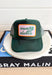 Country Clubbin' Trucker Hat, forest green trucker hat with orange and pink patch in the center of the hat with forest green embroidered text "country clubbin"