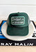 Cowboys & Other Boys Trucker Hat, forest green trucker hat with forest green and kelly green patch in the center of the hat with white embroidered text "cowboys -> other boys <-"