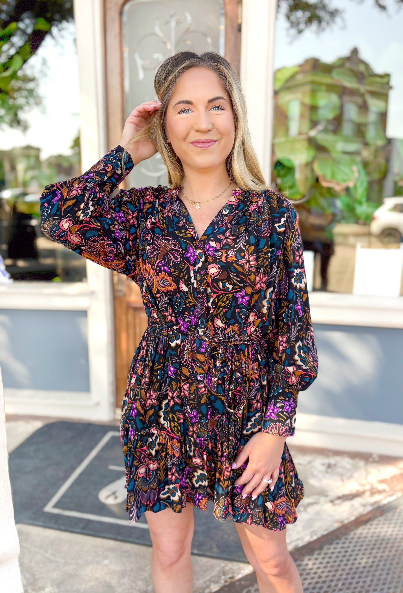 Crushing On You Floral Dress, black floral long sleeve dress with v-neck, floral pattern in the colors purple, coral, burnt orange, cream, teal, and mustard 