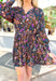 Crushing On You Floral Dress, black floral long sleeve dress with v-neck, floral pattern in the colors purple, coral, burnt orange, cream, teal, and mustard 