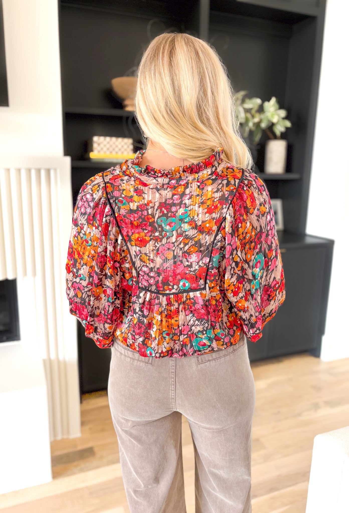 Falling For It Floral Blouse, hot pink, red, orange, cream, teal, and black long sleeve floral blouse with gold tinsel details and a v-neck line 