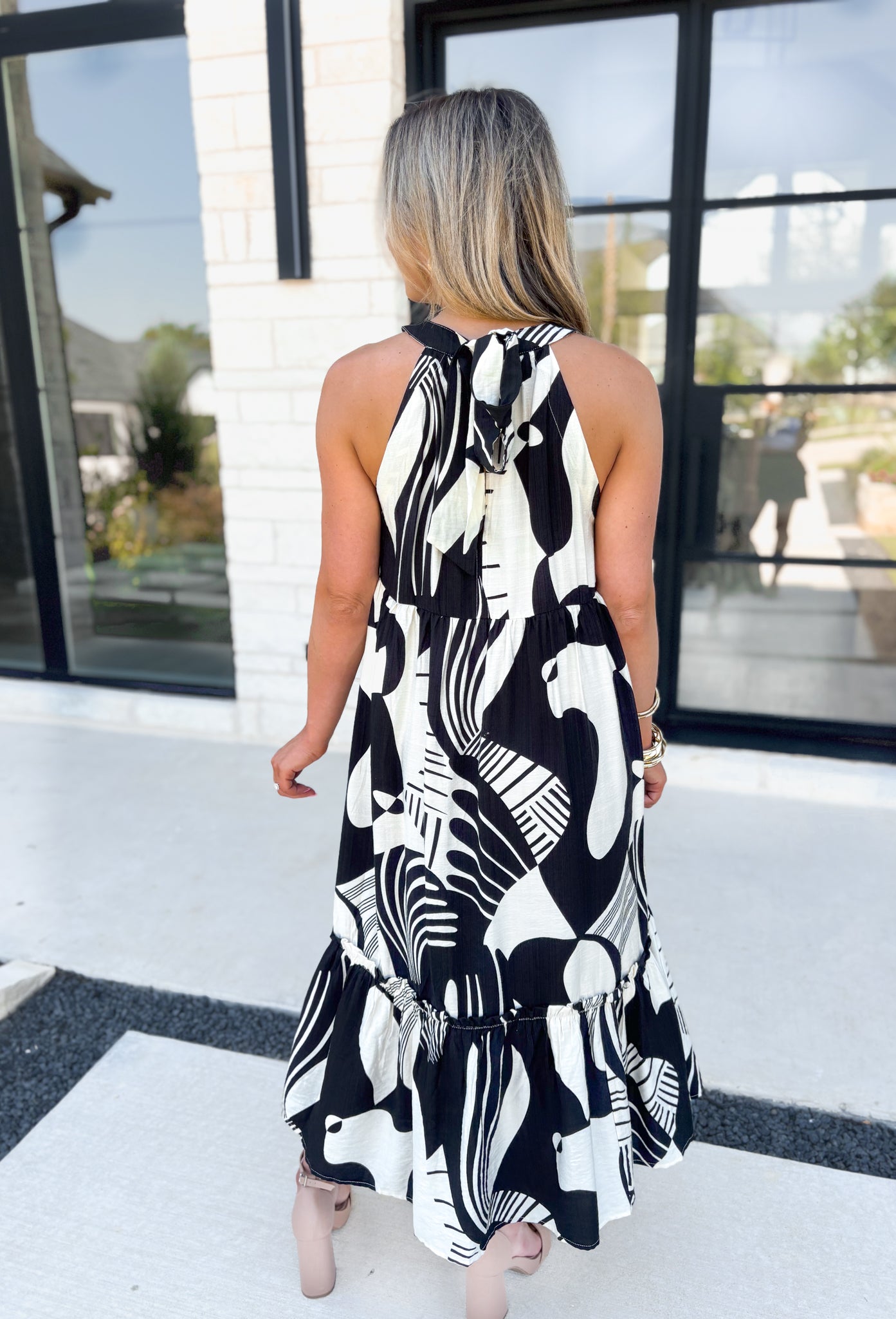 Feel This Moment Midi Dress, black and white abstract shaped high neck tiered sleeveless midi dress with ruffle details on the bottom tier and bow detail on the back of the neck 