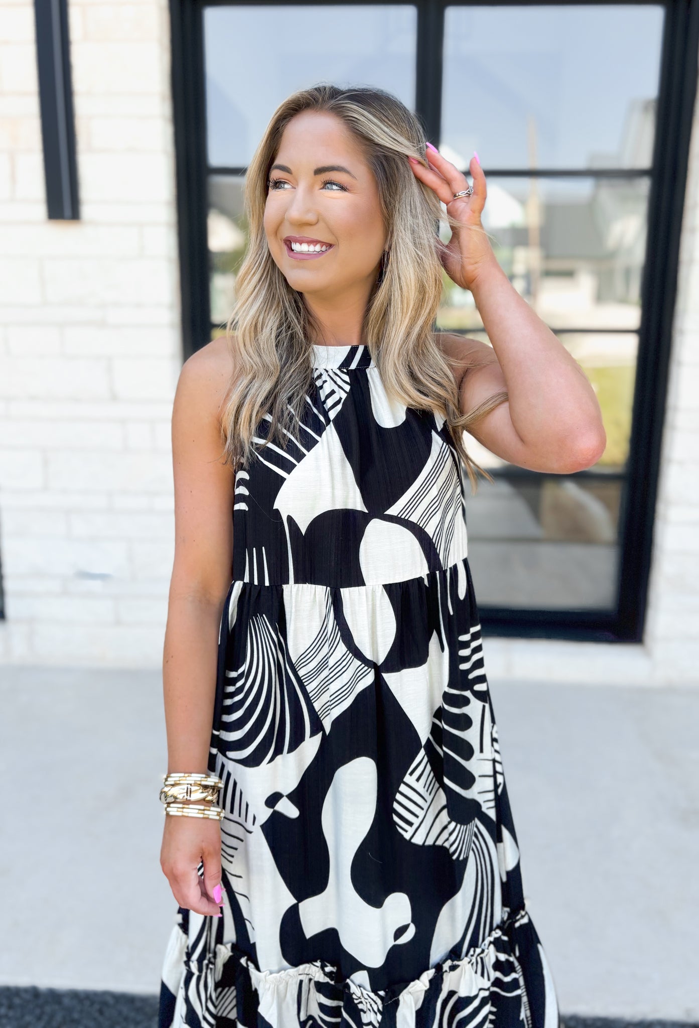 Feel This Moment Midi Dress, black and white abstract shaped high neck tiered sleeveless midi dress with ruffle details on the bottom tier and bow detail on the back of the neck 