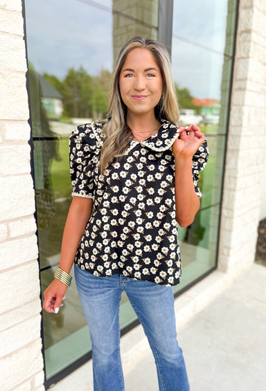 Found My Peace Floral Top, black puff sleeve blouse with white daisy print, mustard details on the floral print, peter pan collar with white scalloping on the hem of the collar and sleeves