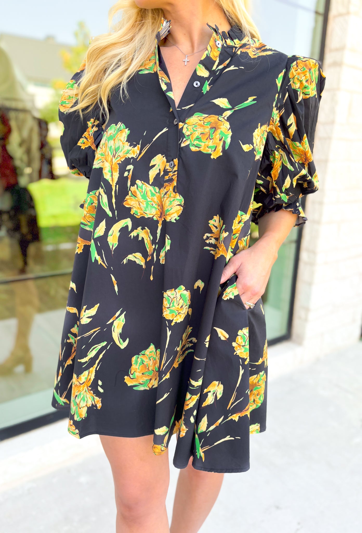 Glimpse Of Us Floral Dress, black, yellow, and green floral quarter button down puff sleeve dress with pleating on the collar and sleeves, tie detail on the back of the dress 