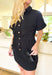 Hard To Leave Dress, black checkered textured dress with built in shorts underneath, button down detail with wooden buttons, cinching at the waist, pockets, and rolled sleeves