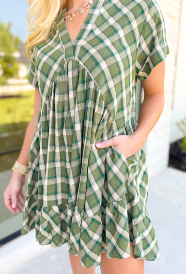 Harvest Cheer Dress, short sleeve v-neck plaid dress in shaded of green, one tier on the bottom of the dress