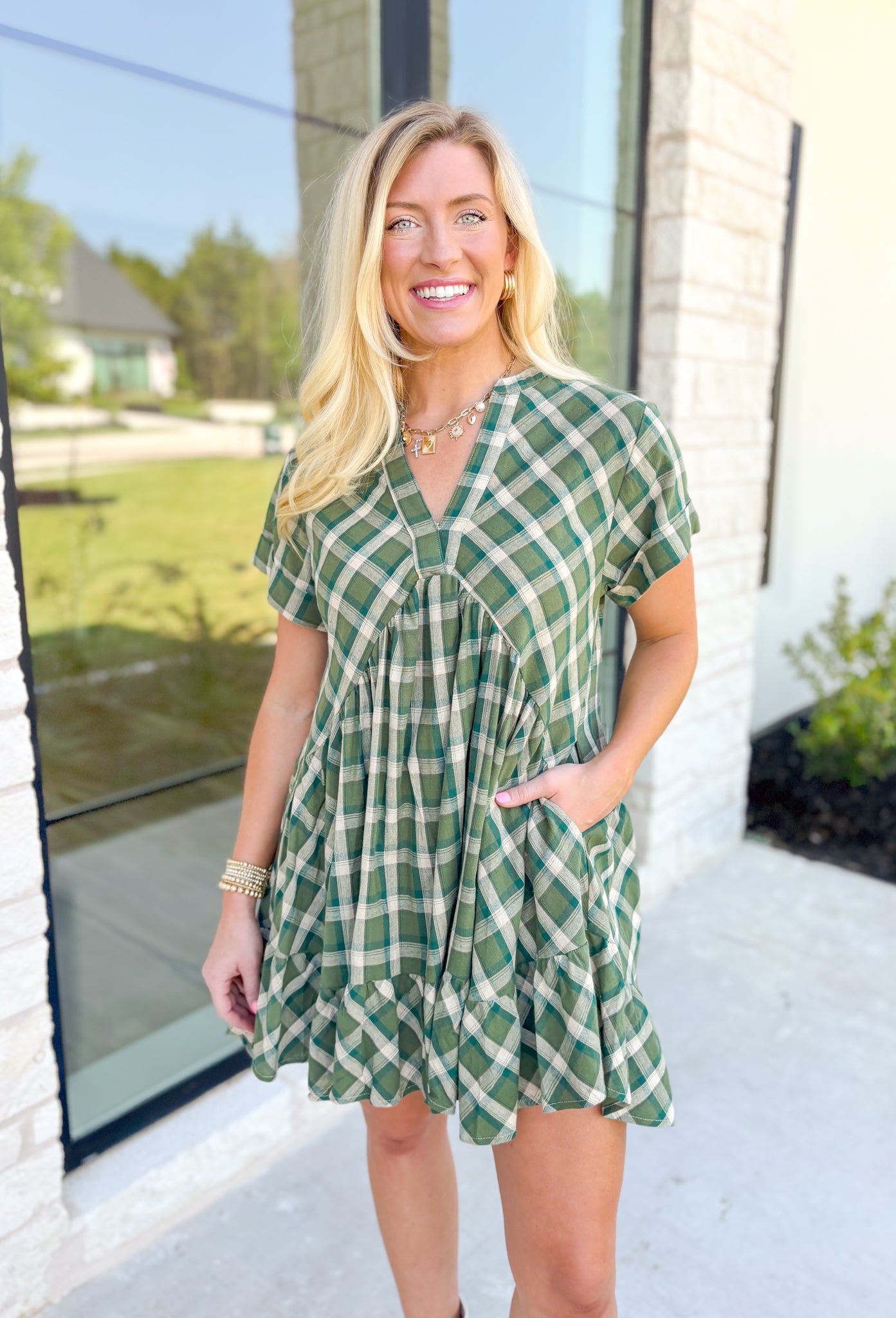 Harvest Cheer Dress, short sleeve v-neck plaid dress in shaded of green, one tier on the bottom of the dress