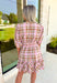 Heading South Plaid Dress, light pink, cognac, and off white plaid puff sleeve mini dress with cinching at the waist with light pink velvet details layered on top of the cinching, tier on the bottom of the dress with ruffle hem detail 