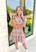 Heading South Plaid Dress, light pink, cognac, and off white plaid puff sleeve mini dress with cinching at the waist with light pink velvet details layered on top of the cinching, tier on the bottom of the dress with ruffle hem detail 