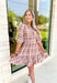 Heading South Plaid Dress, light pink, cognac, and off white plaid puff sleeve mini dress with cinching at the waist with light pink velvet details layered on top of the cinching, tier on the bottom of the dress with ruffle hem detail 