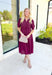 London Calling Midi Dress, wine colored puff sleeve tiered midi dress with cinching on the hem of the sleeves and a v-neck line 