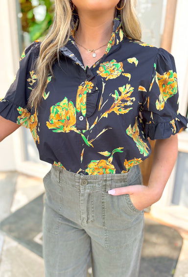 Lost In Time Floral Top, black puff sleeve blouse with ruffling on the hem of the sleeves and neck, quarter button down detail, black blouse with yellow and green floral details 