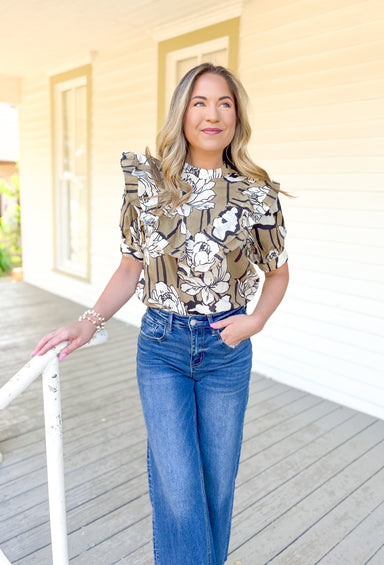 Make It Known Floral Blouse, tan, cream, and black floral blouse, modest neck line, puff sleeves, and ruffling in a v pattern down the chest