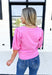 Mind Is Made Up Top, bubble gum pink short sleeve knit top with soft v-neck and white bows on the sleeves 