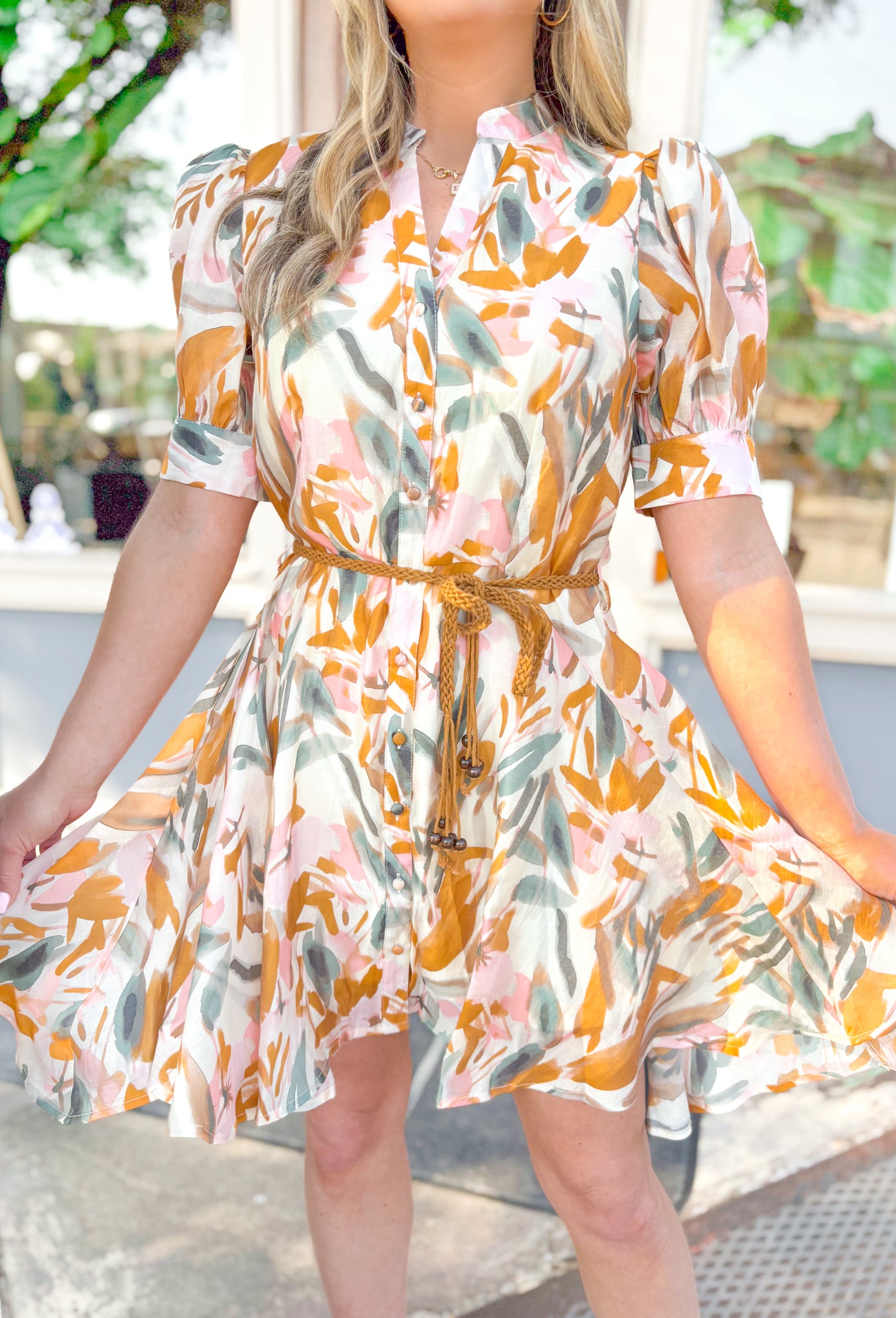 Need You To Know Dress, puff sleeve button down flowy dress, abstract petal print in the colors mustard, light pink, cream and sage, mustard braided belt detail at the waist 