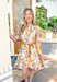 Need You To Know Dress, puff sleeve button down flowy dress, abstract petal print in the colors mustard, light pink, cream and sage, mustard braided belt detail at the waist 