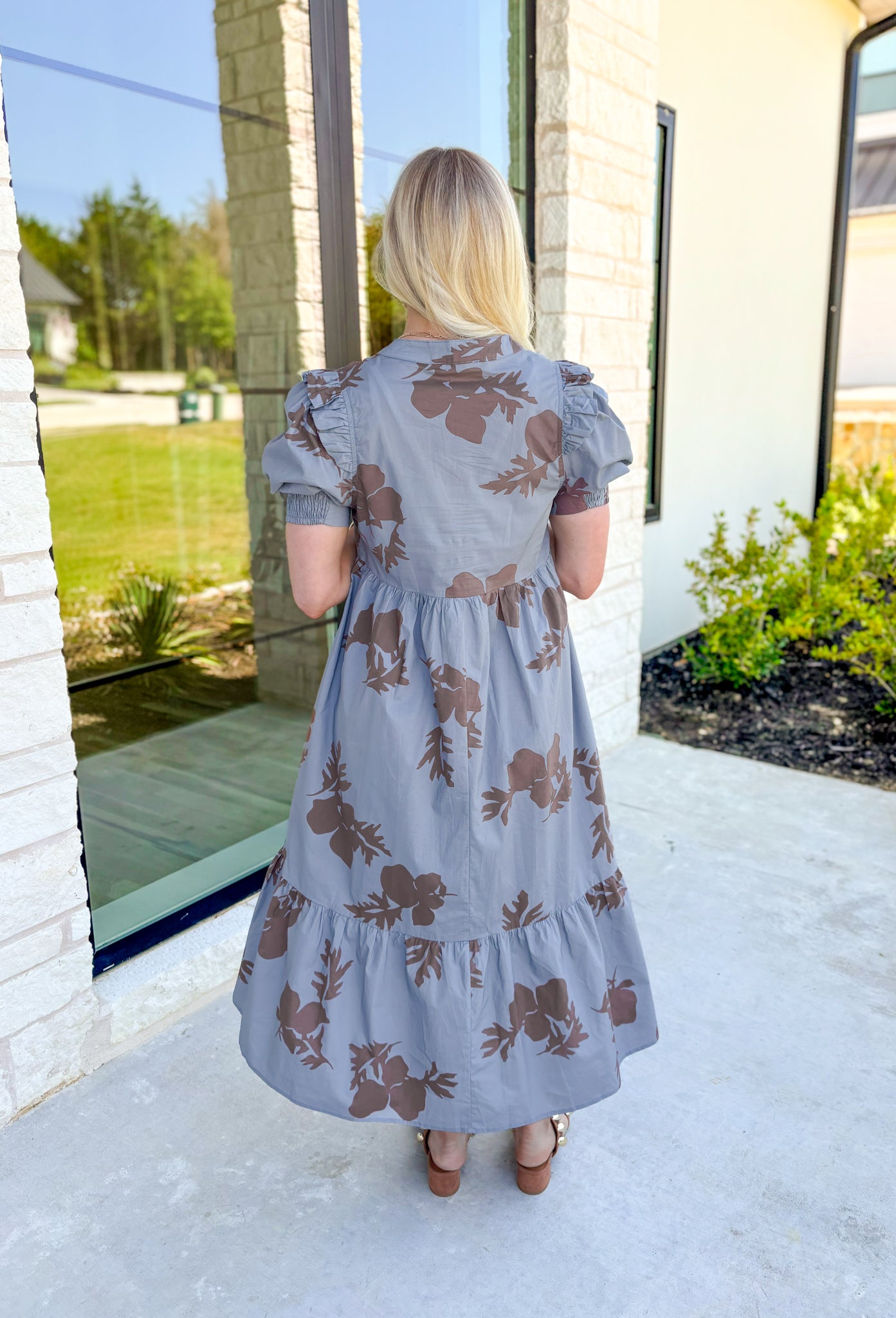 No Looking Back Midi Dress, pale grey blue puff sleeve midi dress with cedar brown floral print and scalloping down the middle of the chest, on tier on the bottom of the dress, pockets