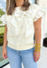 No Second Chances Top, bright cream ruffle sleeve blouse with large bow on the top left side of the chest