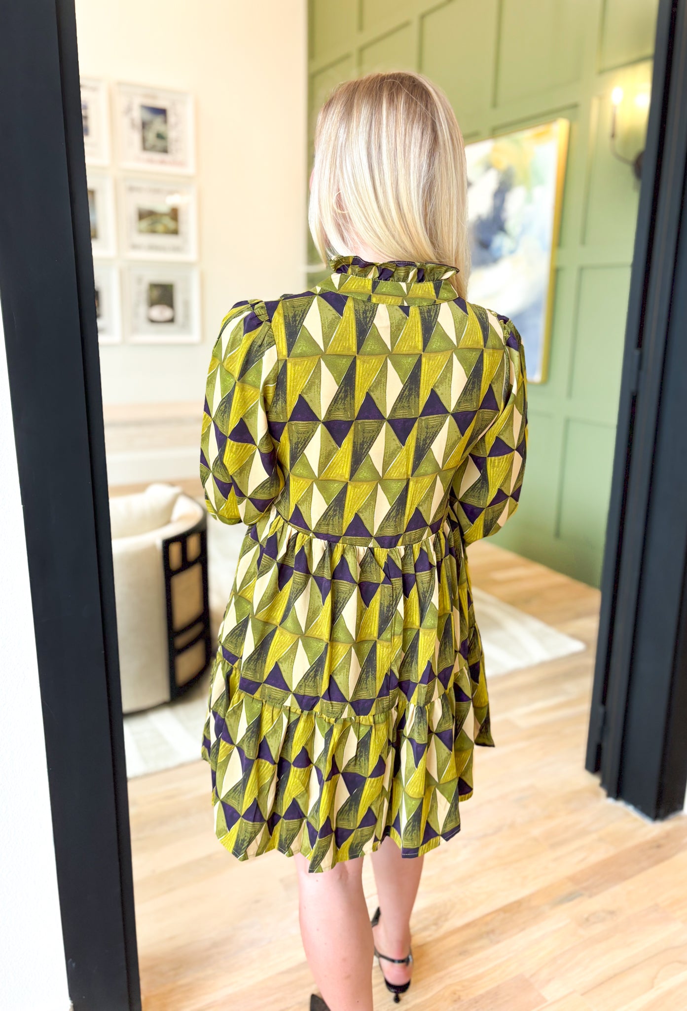 Nothing Better Dress in Olive, long sleeve tiered mini dress with v-neck line and triangle pattern in the colors lime, olive, black with hues of purple in it, and cream