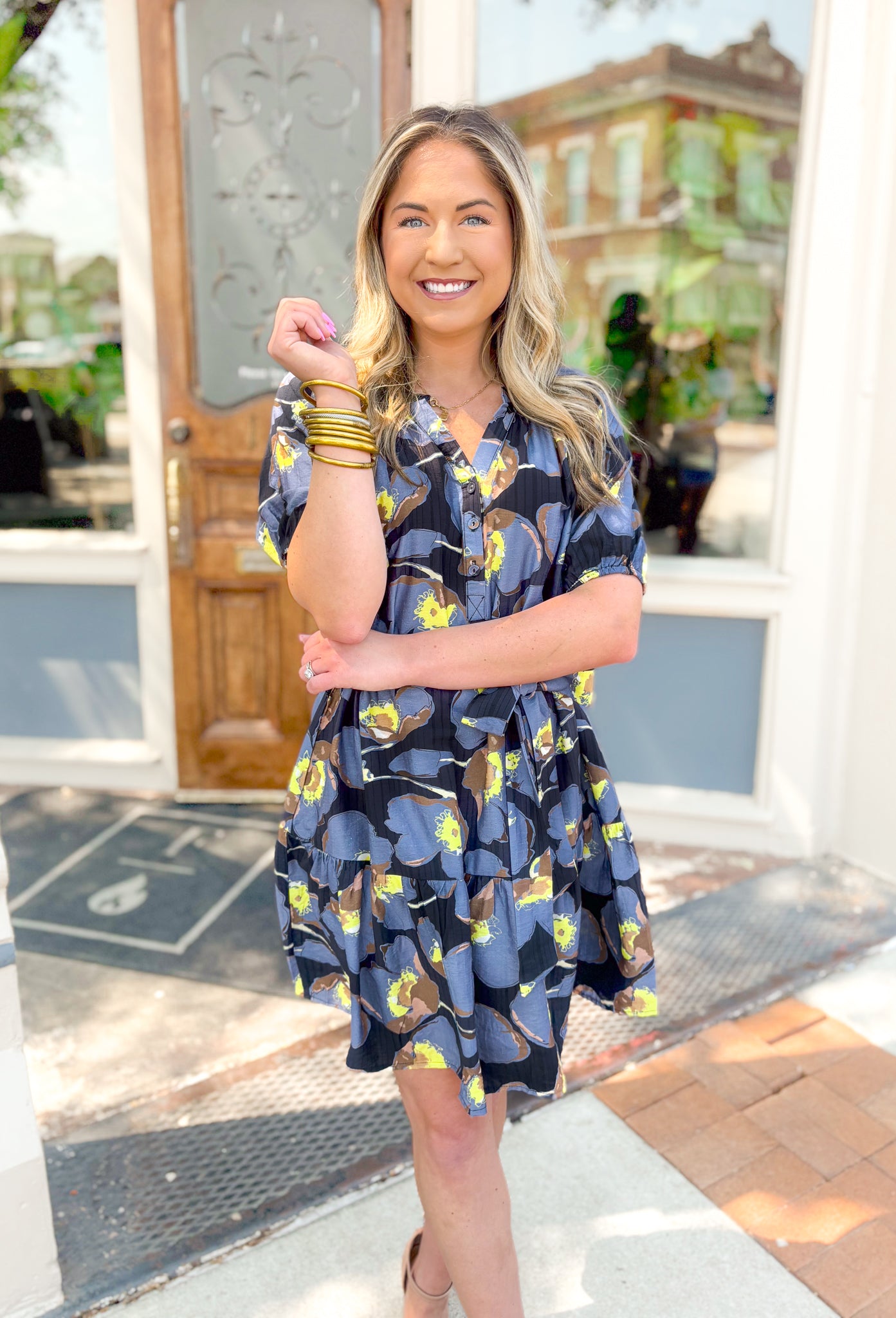 Nothing Better Than This Dress, washed blue, black, brown, and lime green floral short sleeve dress with tiering, v-neck line with quarter length button down detail on the chest