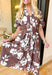 Only Chance Midi Dress, mocha brown short sleeve midi dress with enlarged white and navy floral print, button down detail, pockets, and tie belt