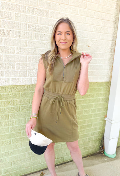 On The Run Dress in Olive, sleeveless quarter zip dress with drawstring waist and pockets in olive