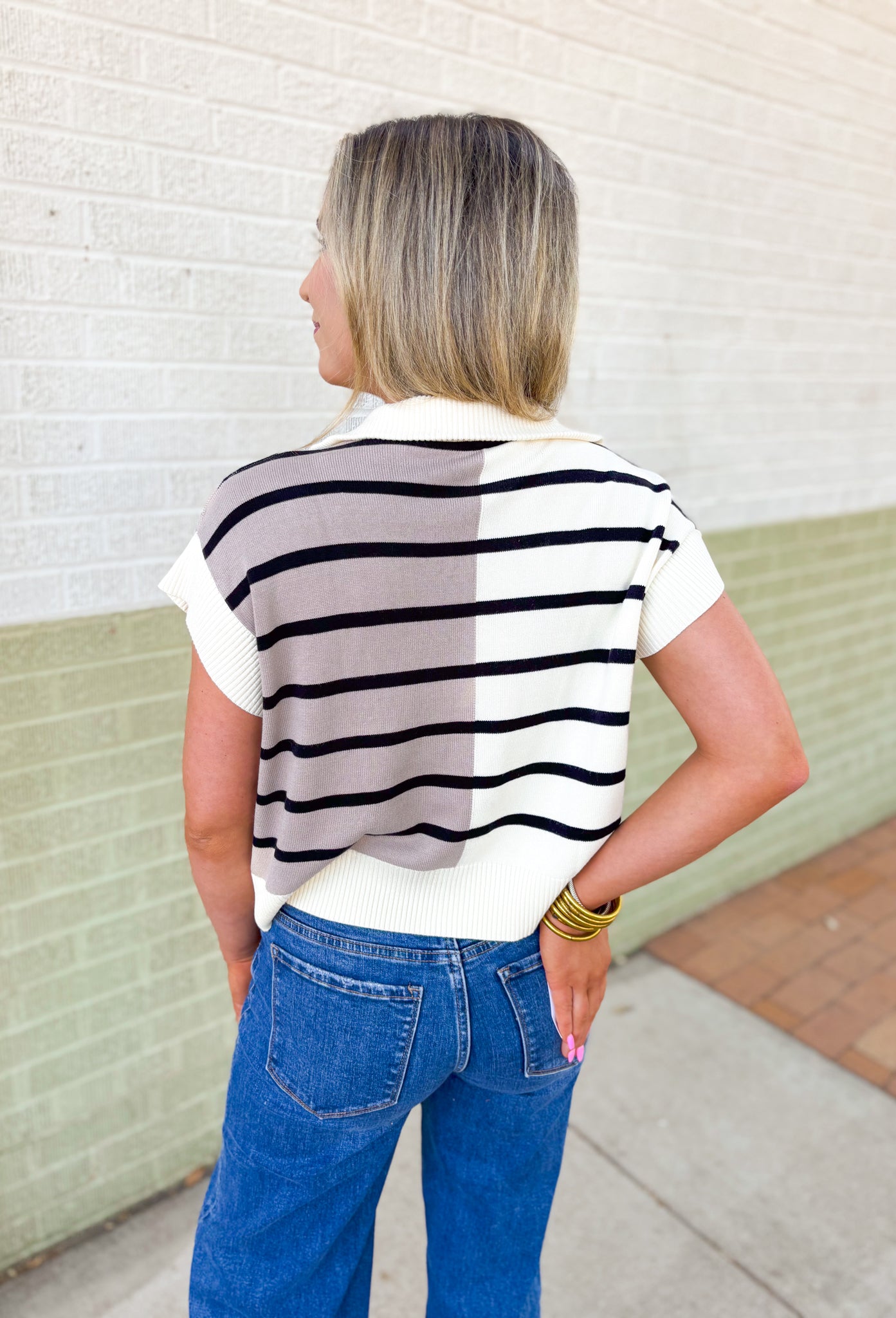 Parting Ways Top, short sleeve sweater top in a color block and striped pattern in the colors taupe, black, and cream, quarter zip detail and collar 