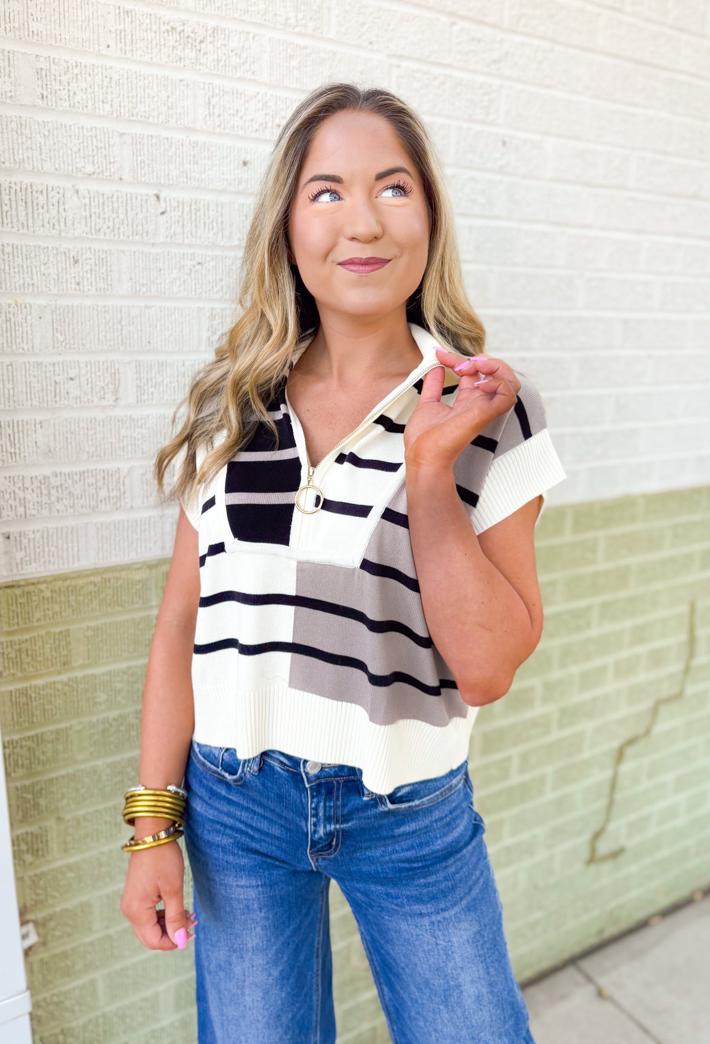 Parting Ways Top, short sleeve sweater top in a color block and striped pattern in the colors taupe, black, and cream, quarter zip detail and collar 