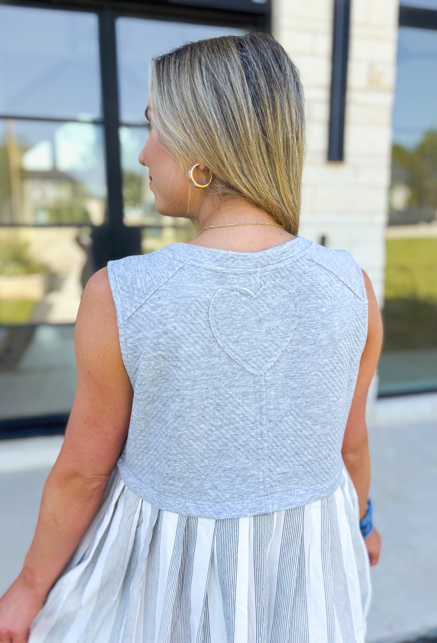 Pay The Price Dress, heathered grey jacquard fabric cropped tank over a white and dark grey pin stripped dress with pockets, heart detail on the back of the dress 