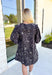 Quiet Moments Floral Dress, quarter puff sleeve mini dress in a deep charcoal grey with cream floral print, platter collar, pockets