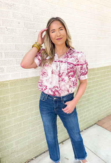 Roaming Rome Floral Blouse, short sleeve plum and off white floral blouse with collar, v-neck, and plum scalloped lace across the chest and around the center of the puff sleeve