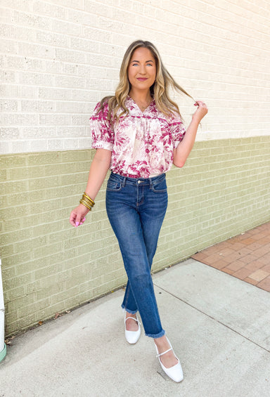 Roaming Rome Floral Blouse, short sleeve plum and off white floral blouse with collar, v-neck, and plum scalloped lace across the chest and around the center of the puff sleeve