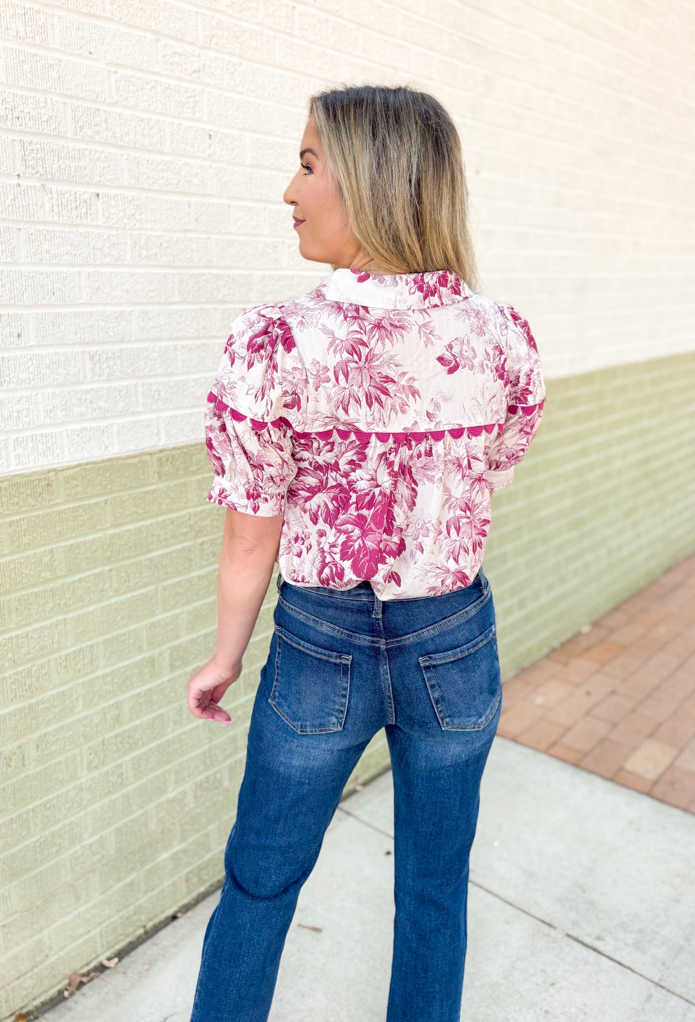 Roaming Rome Floral Blouse, short sleeve plum and off white floral blouse with collar, v-neck, and plum scalloped lace across the chest and around the center of the puff sleeve