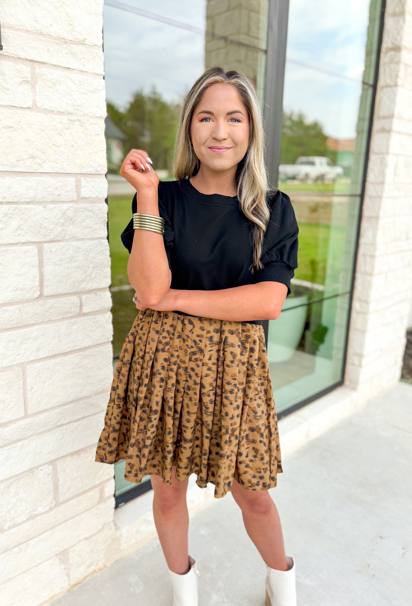 Running Wild Leopard Dress, black short sleeve dress with leopard pleated bottom, heart detail on the back of the dress 