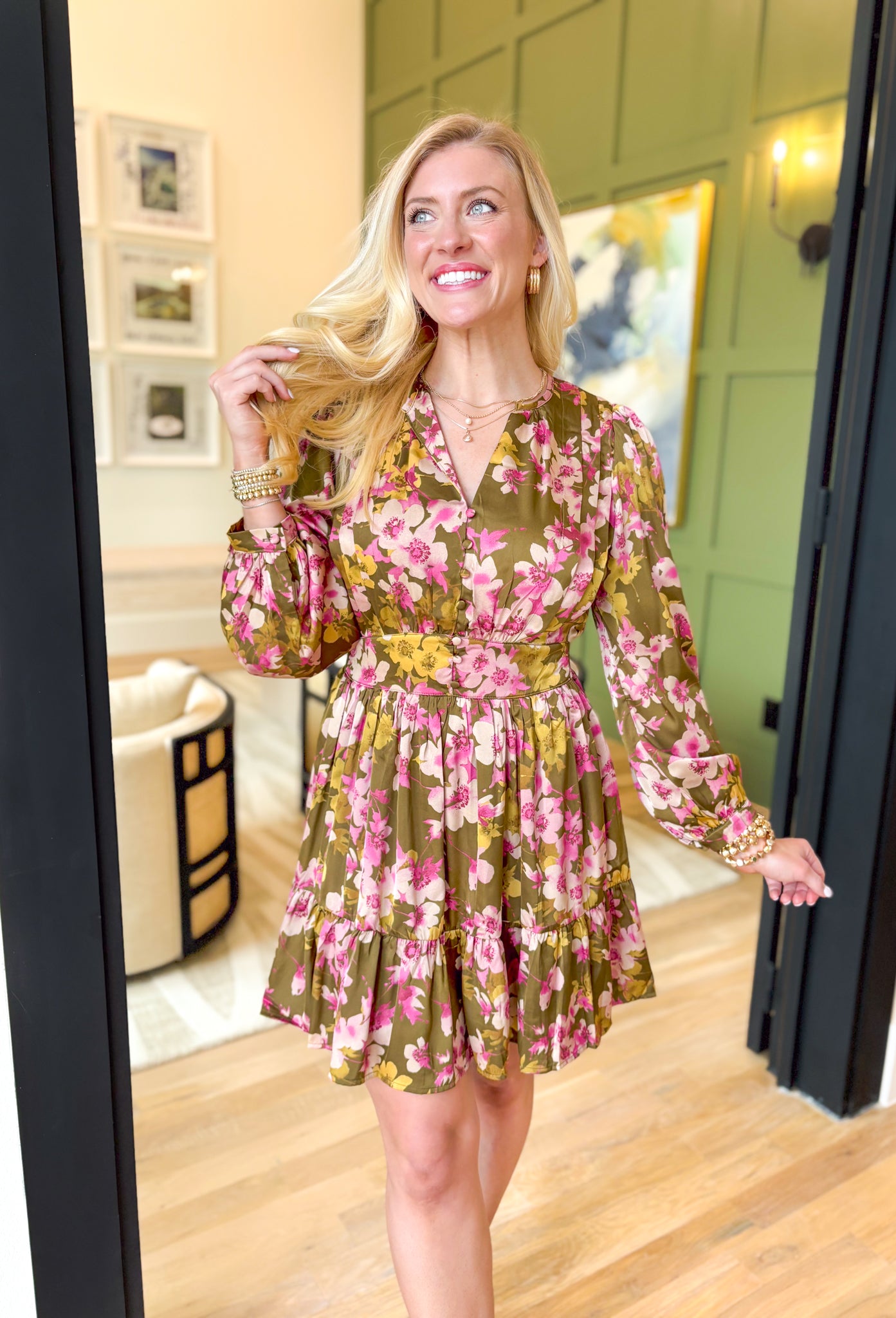 Sealed Fate Floral Dress, olive green long sleeve mini dress with berry, peach, and mustard  floral print. Button detail on the chest, tiering and the waist and bottom of the dress 