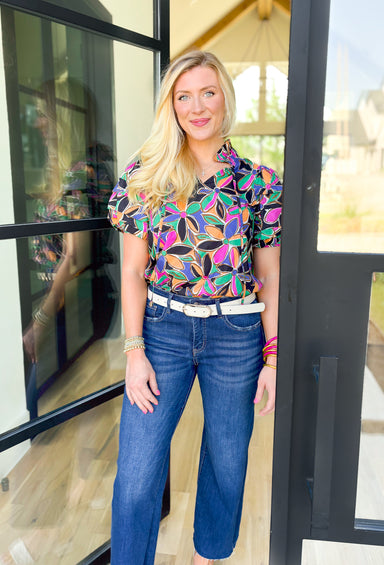 Secret Message Floral Blouse, black, pink, orange, green, blue, and brown floral puff sleeve blouse with ruffling on the neck 