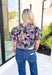 Secret Message Floral Blouse, black, pink, orange, green, blue, and brown floral puff sleeve blouse with ruffling on the neck 