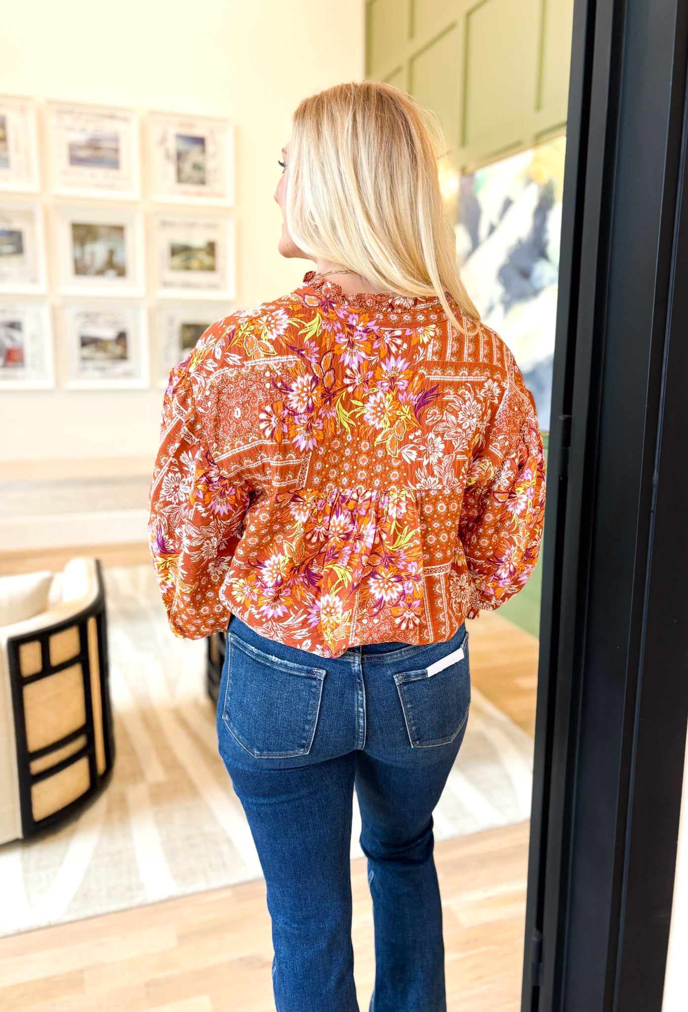 Secret Oasis Floral Blouse, burnt orange quarter sleeve button down blouse, ruffling on the sleeve hem, abstract floral/paisley print in lime, purple, lilac, off white, and mustard 