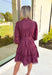 Simply Chic Dress in Merlot, long sleeve pearl button down dress with eyelet lace details on the body, tiers and sleeves of the dress, tie belt detail around the waist, scallop lace detail on the hem of the dress as well as the collar 