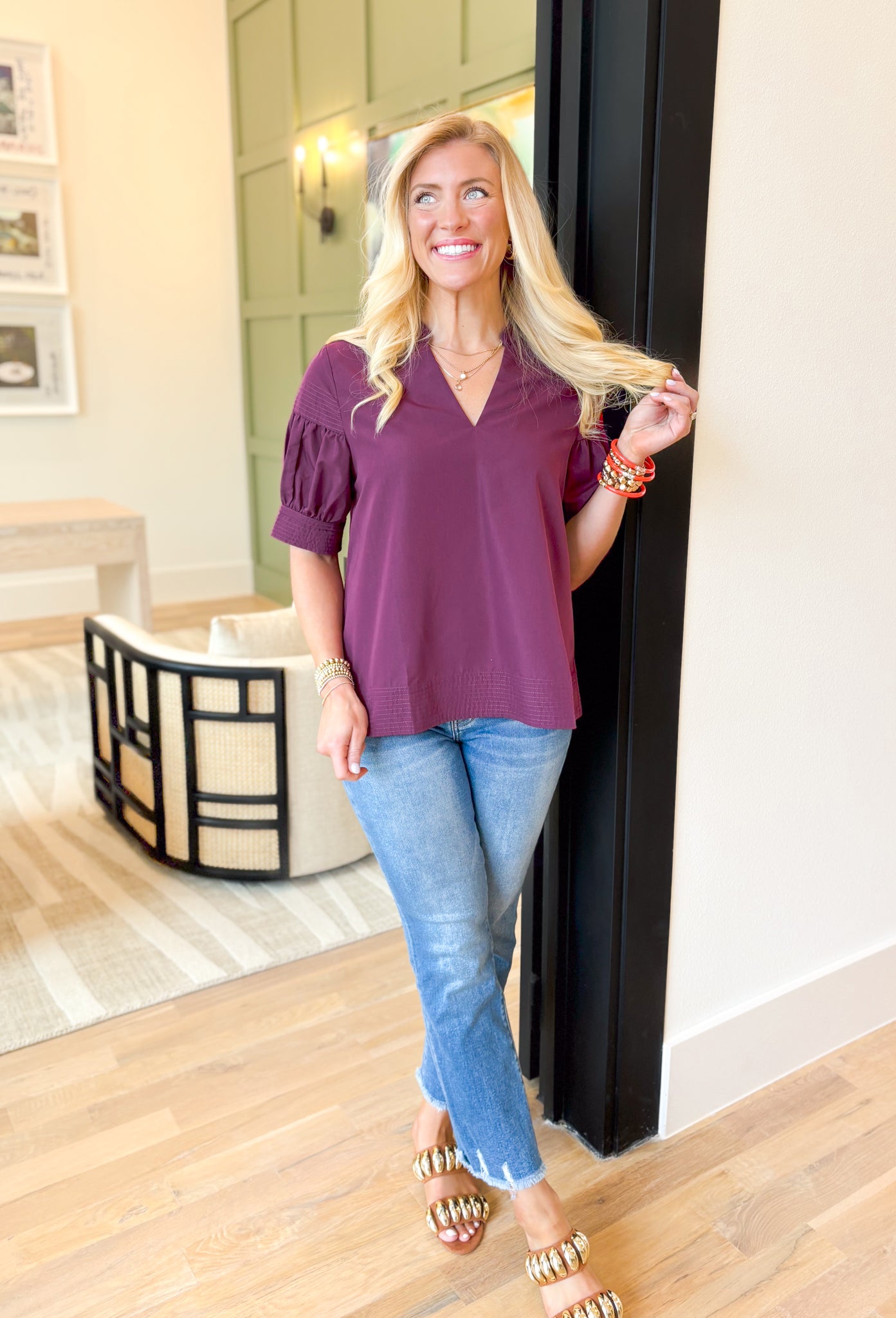 Tell Me The Truth Top, short sleeve blouse in a deep plum, stitch details on the sleeves and bottom of the blouse, v-neckline 